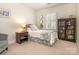 Cozy bedroom with neutral colors, carpet, and an accent wall at 4026 Sharon View Rd, Charlotte, NC 28226