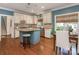 Charming kitchen with granite countertops, a blue island, and hardwood floors at 4026 Sharon View Rd, Charlotte, NC 28226