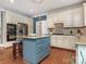 Spacious kitchen with a center island, stainless steel appliances, and classic white cabinets at 4026 Sharon View Rd, Charlotte, NC 28226