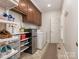 Well-organized laundry room featuring plenty of storage and modern washer and dryer at 4026 Sharon View Rd, Charlotte, NC 28226