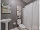 A full bathroom featuring decorative mirror, vanity and shower with curtain at 416 Queens Rd # 10, Charlotte, NC 28207