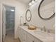 Dual vanity bathroom features granite counters, tiled floors and glass-enclosed shower at 416 Queens Rd # 10, Charlotte, NC 28207