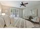Bright bedroom features a ceiling fan, a lot of natural light and modern decor at 416 Queens Rd # 10, Charlotte, NC 28207