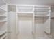 A walk-in closet featuring ample shelving and hanging storage at 416 Queens Rd # 10, Charlotte, NC 28207