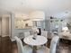 Open-concept dining area with a modern light fixture and a view of the kitchen at 416 Queens Rd # 10, Charlotte, NC 28207