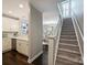 Hallway featuring staircase leading to kitchen and living room at 416 Queens Rd # 10, Charlotte, NC 28207