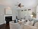 Inviting living room features a fireplace, ceiling fan and French doors leading to the outside at 416 Queens Rd # 10, Charlotte, NC 28207