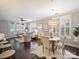 Bright and airy living room featuring plantation shutters, hardwood floors, and elegant furnishings at 416 Queens Rd # 10, Charlotte, NC 28207