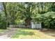 View of backyard featuring home, shed, and a swing set at 417 Phifer Rd, Kings Mountain, NC 28086