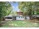 Expansive backyard featuring lush greenery and mature trees offering privacy and shade for outdoor enjoyment at 417 Phifer Rd, Kings Mountain, NC 28086
