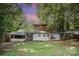 Expansive backyard featuring lush greenery and mature trees offering privacy and shade for outdoor enjoyment at 417 Phifer Rd, Kings Mountain, NC 28086
