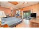 Bedroom with a sliding glass doors, ceiling fan, and wood floors at 417 Phifer Rd, Kings Mountain, NC 28086