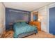 Comfortable bedroom featuring a blue accent wall, carpet, and a dresser with a mirror at 417 Phifer Rd, Kings Mountain, NC 28086