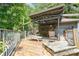 A deck with a hammock, furniture, and surrounding greenery at 417 Phifer Rd, Kings Mountain, NC 28086