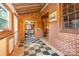 Hallway boasts wood paneled walls, a checkered floor, and a doorway leading to another room at 417 Phifer Rd, Kings Mountain, NC 28086