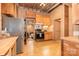 Functional kitchen features wooden cabinets, appliances, and view into other rooms, making meal prep easy at 417 Phifer Rd, Kings Mountain, NC 28086