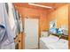 Functional laundry area with white appliances, a water heater, and storage shelving at 417 Phifer Rd, Kings Mountain, NC 28086