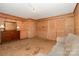 Living Room shows wood paneling, carpet, lamps, door, and sofa at 417 Phifer Rd, Kings Mountain, NC 28086