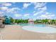 Resort-style pool and splash pad, complete with lounge chairs, umbrellas, and a slide for residents' enjoyment at 5092 Nighthawk Dr, Indian Land, SC 29707