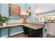 Charming home office nook with granite countertop, dark wood cabinets, and stylish decor at 5092 Nighthawk Dr, Indian Land, SC 29707