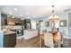 Open kitchen with stainless steel appliances, island, and easy access to the dining area at 5092 Nighthawk Dr, Indian Land, SC 29707
