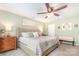 Spacious main bedroom with a ceiling fan, accent pillows, and soft lighting for a relaxing ambiance at 5092 Nighthawk Dr, Indian Land, SC 29707