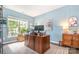Bright office space featuring natural light, a large desk, and a serene blue color scheme at 5092 Nighthawk Dr, Indian Land, SC 29707