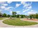 Community playground featuring play structures, a grassy field, and walking paths in a Gathering-friendly neighborhood at 5092 Nighthawk Dr, Indian Land, SC 29707