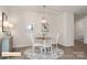 Dining area showcasing a stylish light fixture and seating for four at 523 Hullview Vis, Monroe, NC 28110