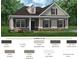 Charming single-Gathering home with gray siding, dark shutters, and a well-manicured front lawn at 523 Hullview Vis, Monroe, NC 28110