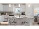 Well-equipped kitchen with an island, granite countertops, and bright white cabinets at 523 Hullview Vis, Monroe, NC 28110