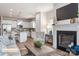 Open-concept living space with fireplace, view of the kitchen, and comfortable seating at 523 Hullview Vis, Monroe, NC 28110