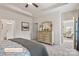 Bright main bedroom showcasing a decorative dresser, tray ceiling, and modern finishes at 523 Hullview Vis, Monroe, NC 28110