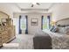 Light-filled main bedroom with neutral walls, tray ceiling, and large windows at 523 Hullview Vis, Monroe, NC 28110