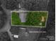 Aerial view of a property showing approximate lot lines surrounded by lush greenery at 535 Norman Fair Ave, Lincolnton, NC 28092