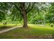 Expansive backyard featuring a gazebo and lush greenery at 535 Norman Fair Ave, Lincolnton, NC 28092