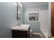 Bathroom with updated vanity, lighting, and bathtub at 535 Norman Fair Ave, Lincolnton, NC 28092