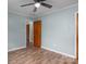 Spacious bedroom featuring modern wood-look floors and neutral wall color at 535 Norman Fair Ave, Lincolnton, NC 28092