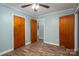 Neutral bedroom with modern wood-look floors and multiple closets for ample storage space at 535 Norman Fair Ave, Lincolnton, NC 28092