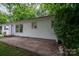 A quaint home featuring a concrete patio, white siding, and trimmed bushes at 535 Norman Fair Ave, Lincolnton, NC 28092