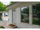 Close-up of the white front door with glass inset, set against light siding at 535 Norman Fair Ave, Lincolnton, NC 28092
