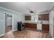 Charming kitchen with wood cabinets, stainless steel appliances, modern countertops, and wood-look floors at 535 Norman Fair Ave, Lincolnton, NC 28092