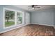 Well-lit living room boasts wood laminate flooring, large windows, and neutral paint for a modern feel at 535 Norman Fair Ave, Lincolnton, NC 28092