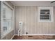 Enclosed sunroom featuring wood-look floors, whitewashed paneling, and double-hung windows for natural light at 535 Norman Fair Ave, Lincolnton, NC 28092