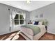 Serene bedroom with soft natural light, a comfortable bed, and soothing color palette at 6004 Trailwater Rd, Charlotte, NC 28278