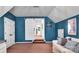 Bonus room, accented by blue walls and features a sliding door to the adjacent space at 6004 Trailwater Rd, Charlotte, NC 28278