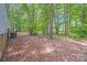 Private wooded backyard provides a serene outdoor space with mature trees at 6010 Old Pageland Marshville Rd, Marshville, NC 28103