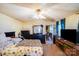 Spacious bedroom with ceiling fan, dresser, and view into dining area at 6010 Old Pageland Marshville Rd, Marshville, NC 28103