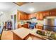 Eat-in kitchen area featuring wooden cabinets, sink, and appliances at 6010 Old Pageland Marshville Rd, Marshville, NC 28103