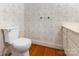Cozy bathroom showcasing a toilet, vanity, and patterned wallpaper at 704 Little Creek Dr, Kings Mountain, NC 28086